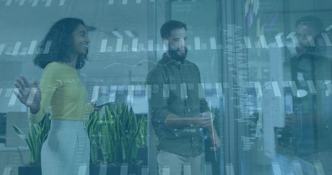 Professionals Analyzing Data on Glass Screen in Modern Office