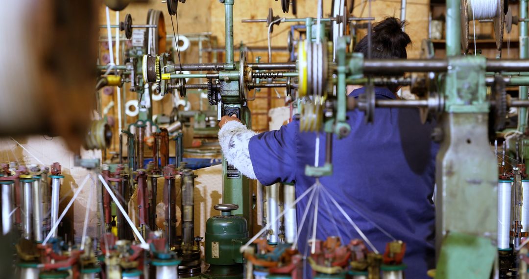 Worker Operating Textile Machine in Factory - Free Images, Stock Photos and Pictures on Pikwizard.com