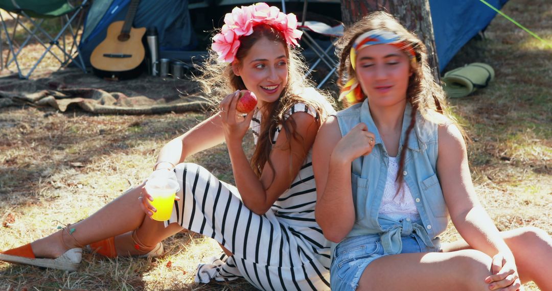 Two Young Women Enjoying Outdoors at a Summer Festival - Free Images, Stock Photos and Pictures on Pikwizard.com