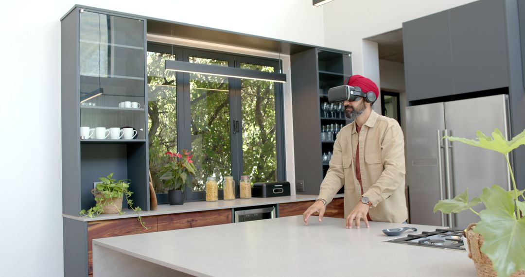 Man Wearing VR Headset Experiencing Virtual Reality in Modern Kitchen