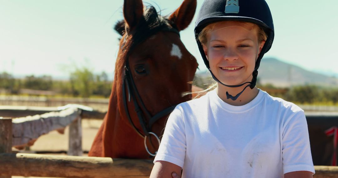 Smiling Girl with Helmet Standing Near Her Horse at Stable - Free Images, Stock Photos and Pictures on Pikwizard.com