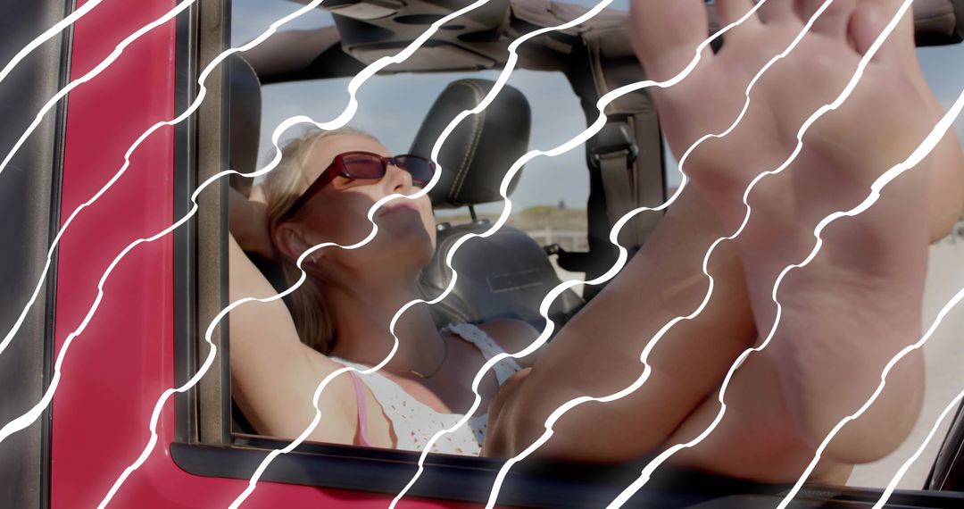 Woman Relaxing in Red Convertible Enjoying Sun in Desert