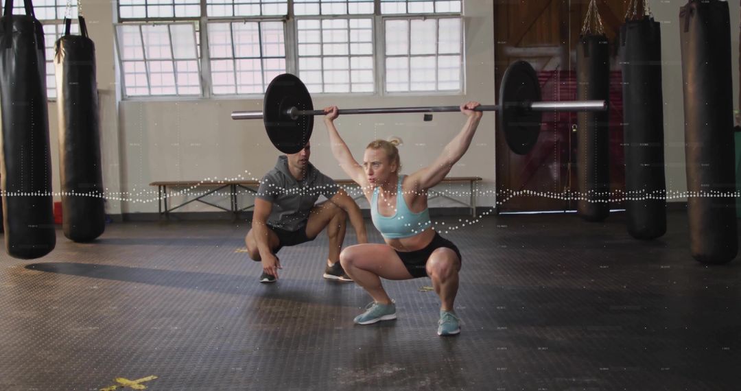 Woman Weighlifting: Intense Training with Overhead Squat Support