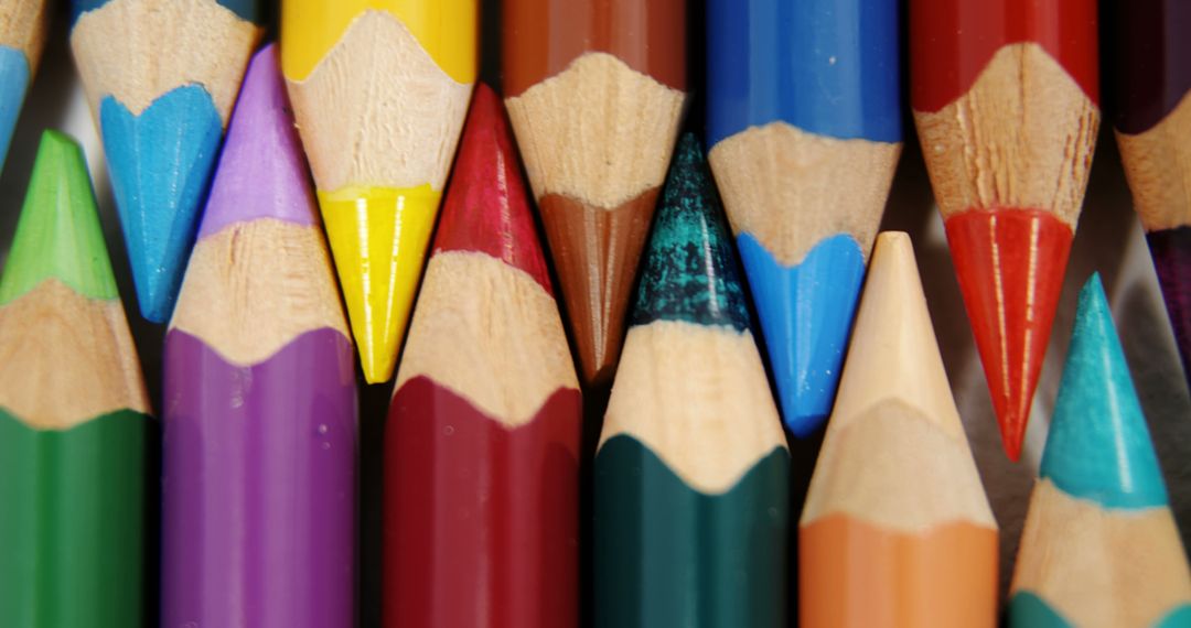 A vibrant array of sharpened colored pencils are closely arranged, showcasing a spectrum of hues - Free Images, Stock Photos and Pictures on Pikwizard.com
