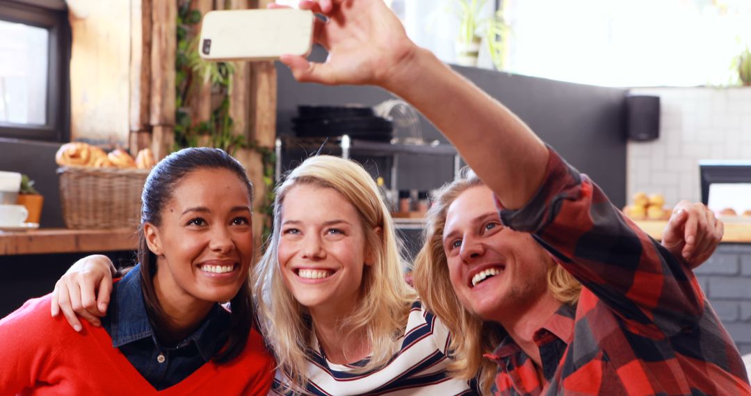 Friends Taking a Selfie in a Café - Free Images, Stock Photos and Pictures on Pikwizard.com