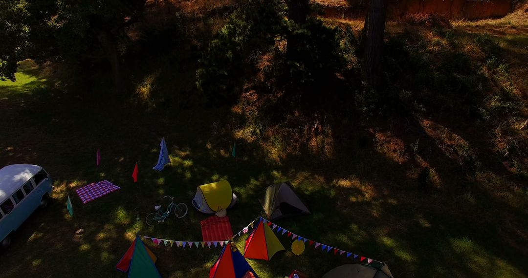 Aerial View of Colorful Tents in Forested Campsite - Free Images, Stock Photos and Pictures on Pikwizard.com