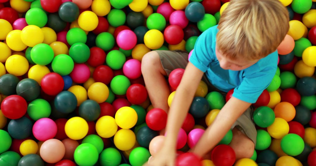 Child Playing in Colorful Ball Pit - Free Images, Stock Photos and Pictures on Pikwizard.com