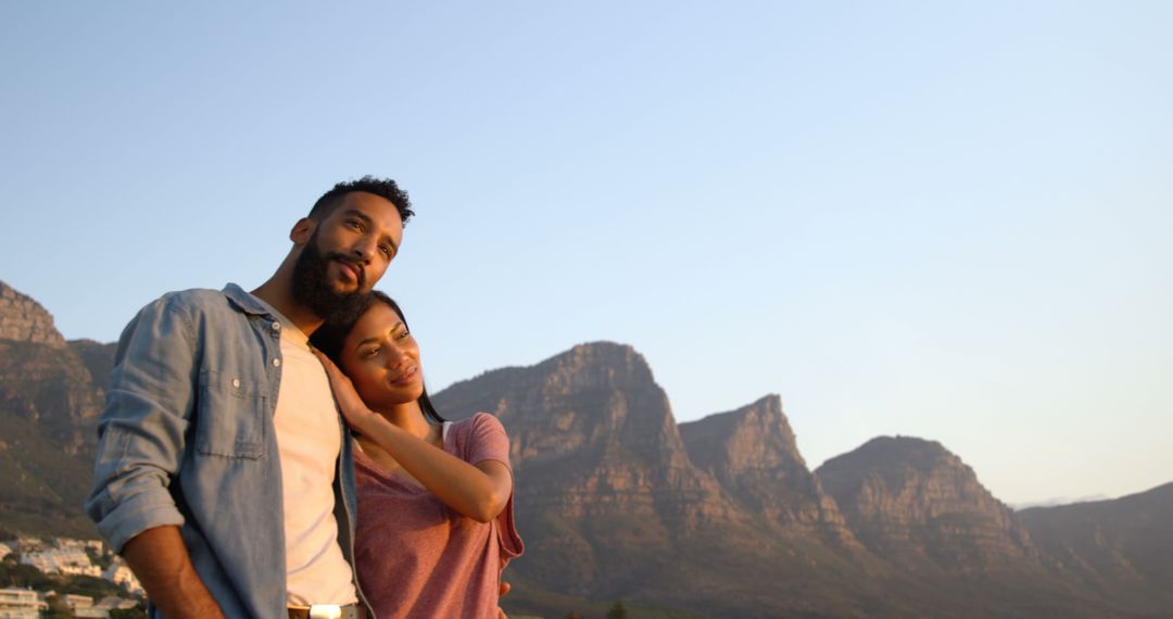 Couple Enjoying Scenic Mountain View at Sunset - Free Images, Stock Photos and Pictures on Pikwizard.com