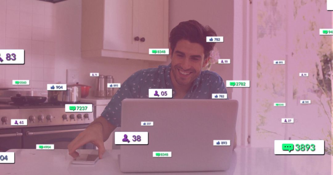 Man Engaging with Digital Notifications on Laptop in Kitchen