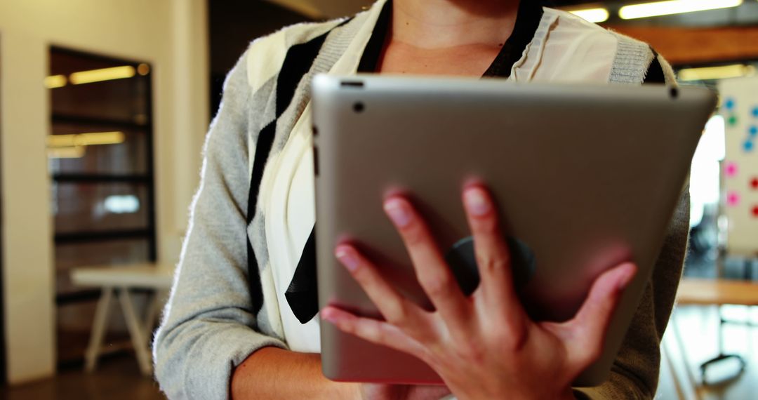Business Person Using Digital Tablet in Modern Office