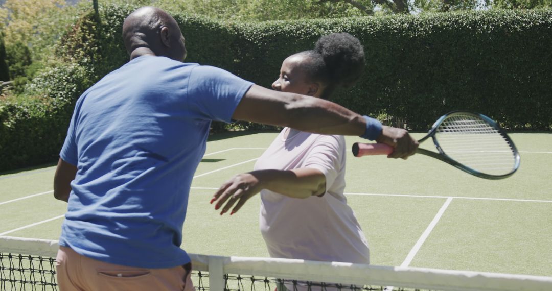 Two African American Tennis Players Sharing a Hug on Court - Free Images, Stock Photos and Pictures on Pikwizard.com