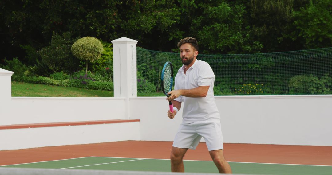 Man Playing Tennis on Outdoor Court - Free Images, Stock Photos and Pictures on Pikwizard.com