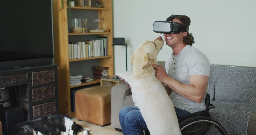 Man in Wheelchair Using Virtual Reality with Dog at Home - Free Images, Stock Photos and Pictures on Pikwizard.com