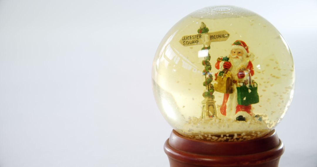 Christmas Snow Globe with Santa Claus Carrying Gifts - Free Images, Stock Photos and Pictures on Pikwizard.com