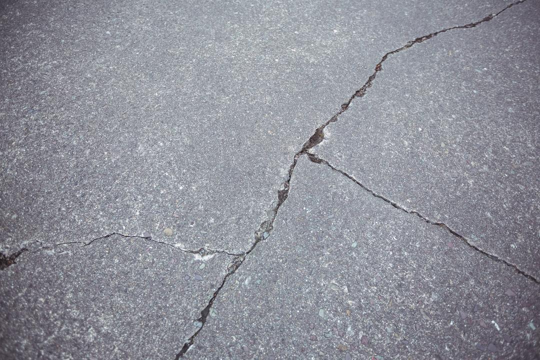 Close-up of cracked asphalt road background - Free Images, Stock Photos and Pictures on Pikwizard.com