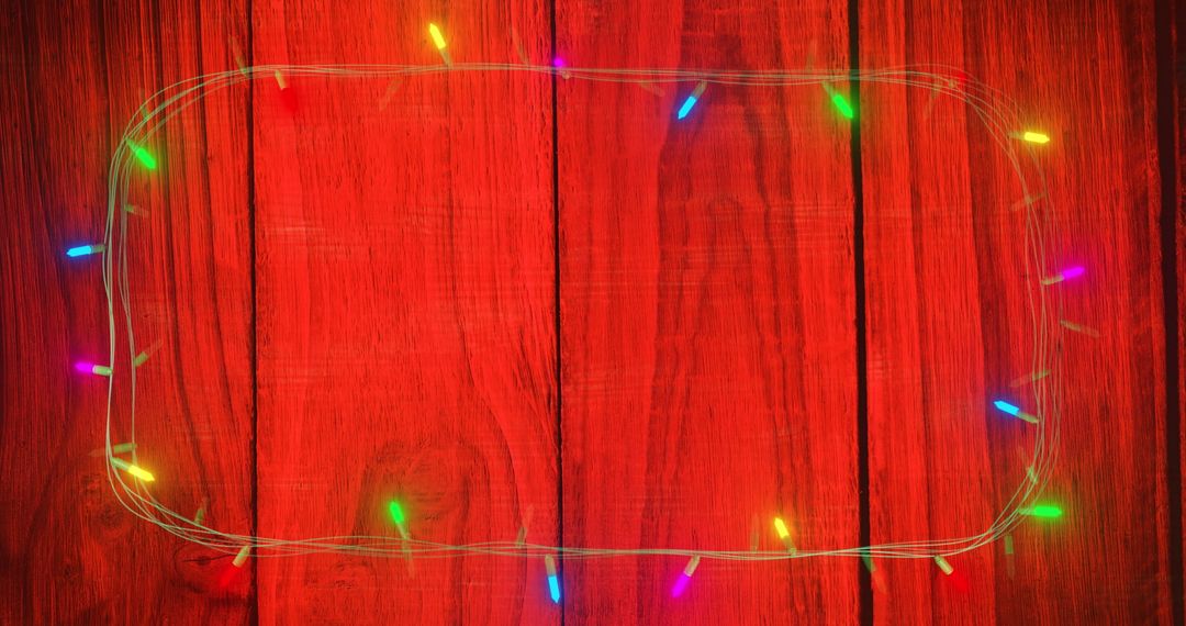 Colorful Christmas Lights on Red Wooden Background - Free Images, Stock Photos and Pictures on Pikwizard.com