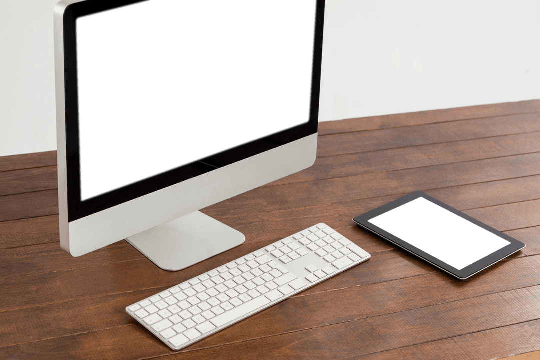 Transparent Desktop Display with Keyboard Next to Digital Tablet on Wooden Table