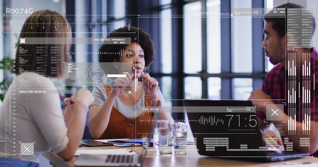 Diverse Colleagues Using Data Interfaces in Modern Office Meeting