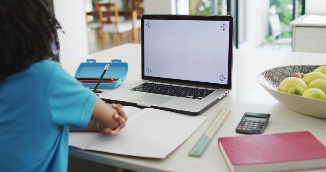 Boy Learning Online with Blank Laptop Screen