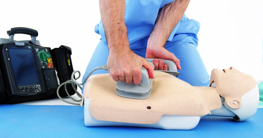 Medical Professional Practicing CPR on Training Dummy - Free Images, Stock Photos and Pictures on Pikwizard.com