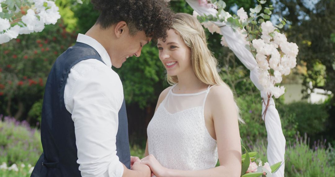 Joyful Couple in Tender Moment at Outdoor Wedding Ceremony