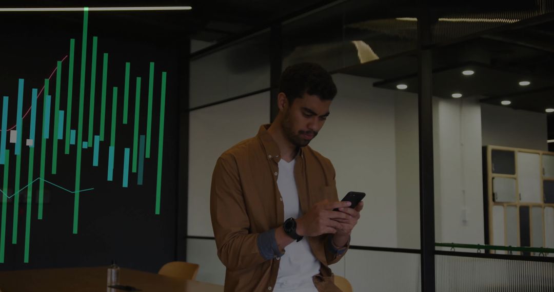 Professional Analyzing Data on Smartphone in Modern Office Space
