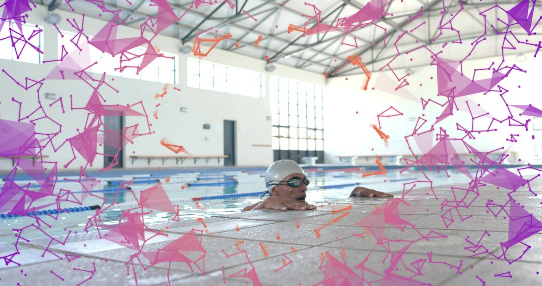 Male swimmer resting at pool edge while grasping ledge with vibrant geometric overlay