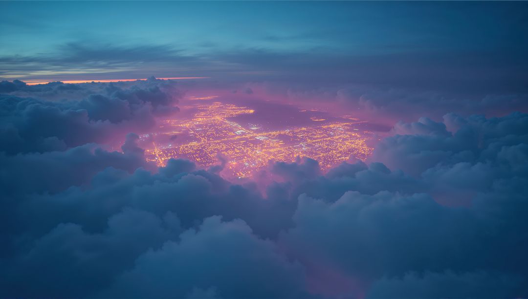 Aerial Cityscape Glowing Through Dense Clouds at Twilight