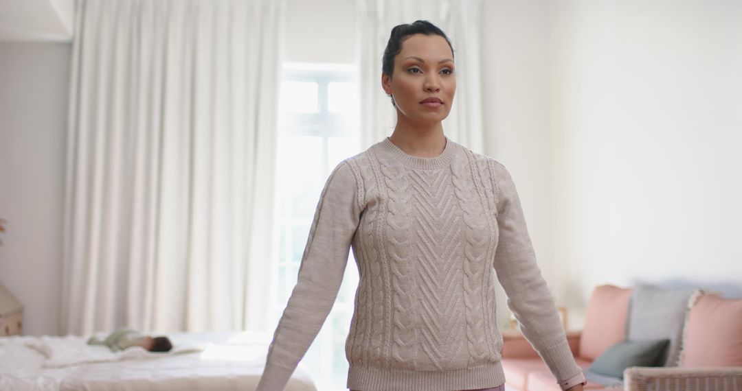 Mother Monitoring Infant in Cozy Bedroom Setting