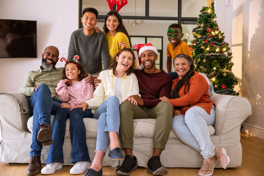 Diverse Family Smiling for Holiday Celebration with Christmas Tree