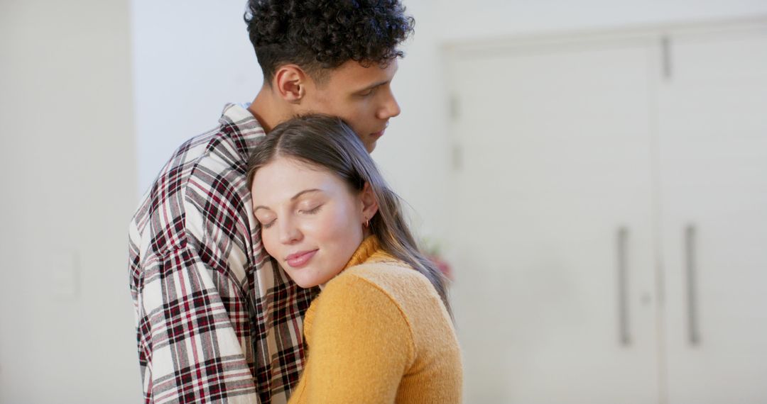 Couple Embracing Tenderly at Home in Cozy Setting