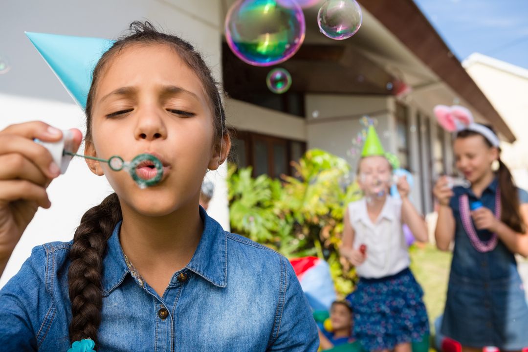 Girl blowing bubbles - Free Images, Stock Photos and Pictures on Pikwizard.com