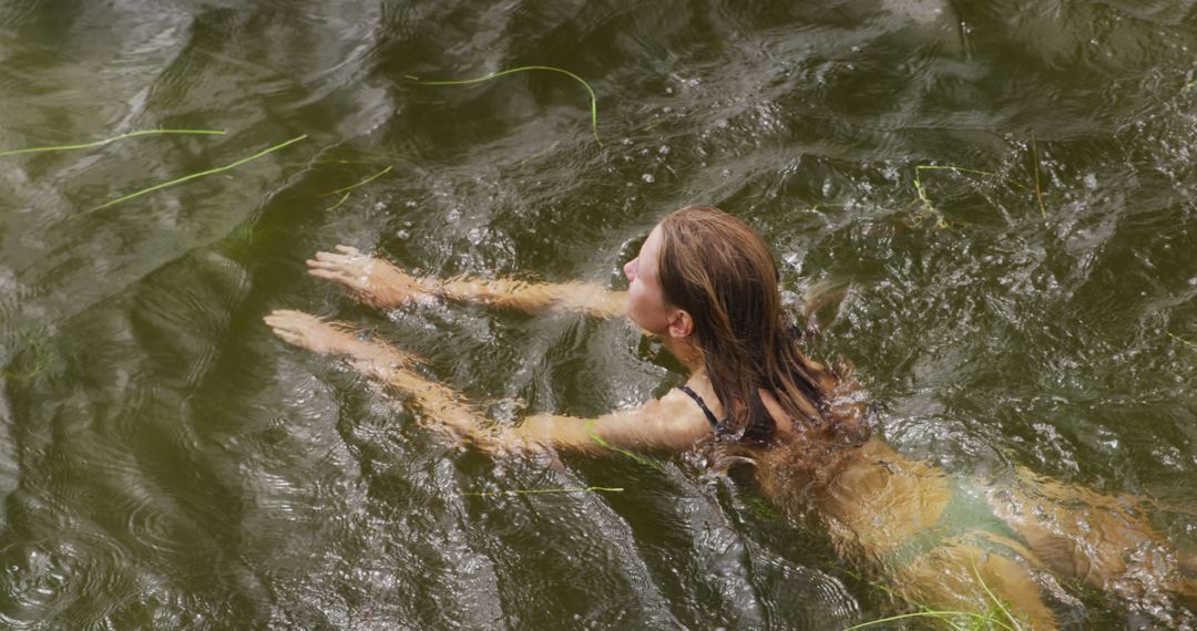 Woman Swimming in Natural Lake On Vacation - Free Images, Stock Photos and Pictures on Pikwizard.com