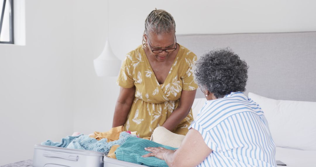 Elderly African American Women Packing Suitcase for Vacation