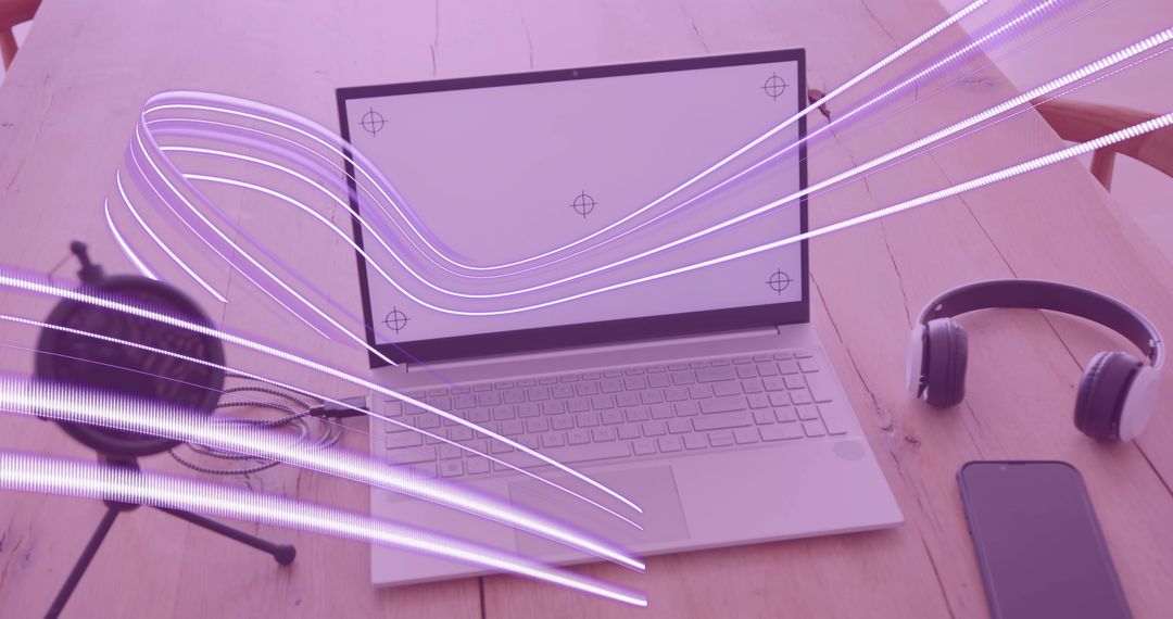 Modern Workspace with Artistic Light Streaks and Digital Devices