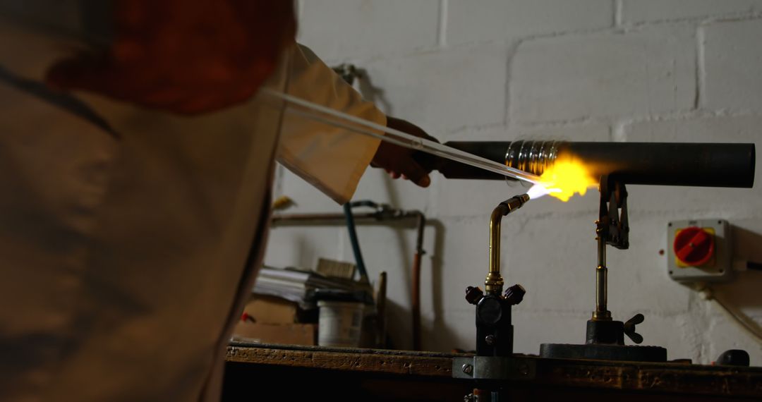 Glassworker Heating Rods in Workshop - Free Images, Stock Photos and Pictures on Pikwizard.com