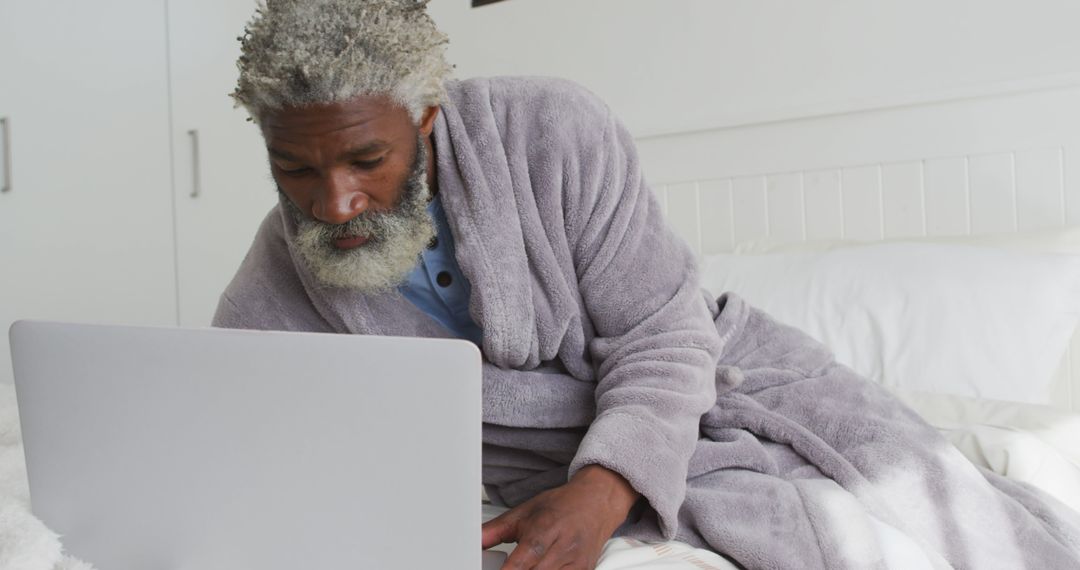 Senior Man Relaxing in Bed Using Laptop - Free Images, Stock Photos and Pictures on Pikwizard.com