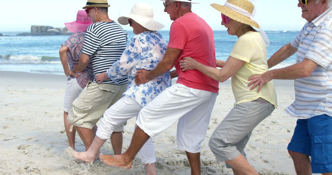 Seniors Having Fun in Conga Line on Beach Vacation - Free Images, Stock Photos and Pictures on Pikwizard.com