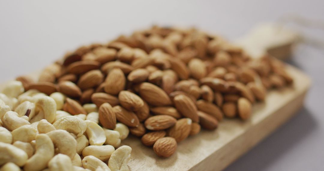 Assorted Nuts on Wooden Board for Healthy Eating Concepts