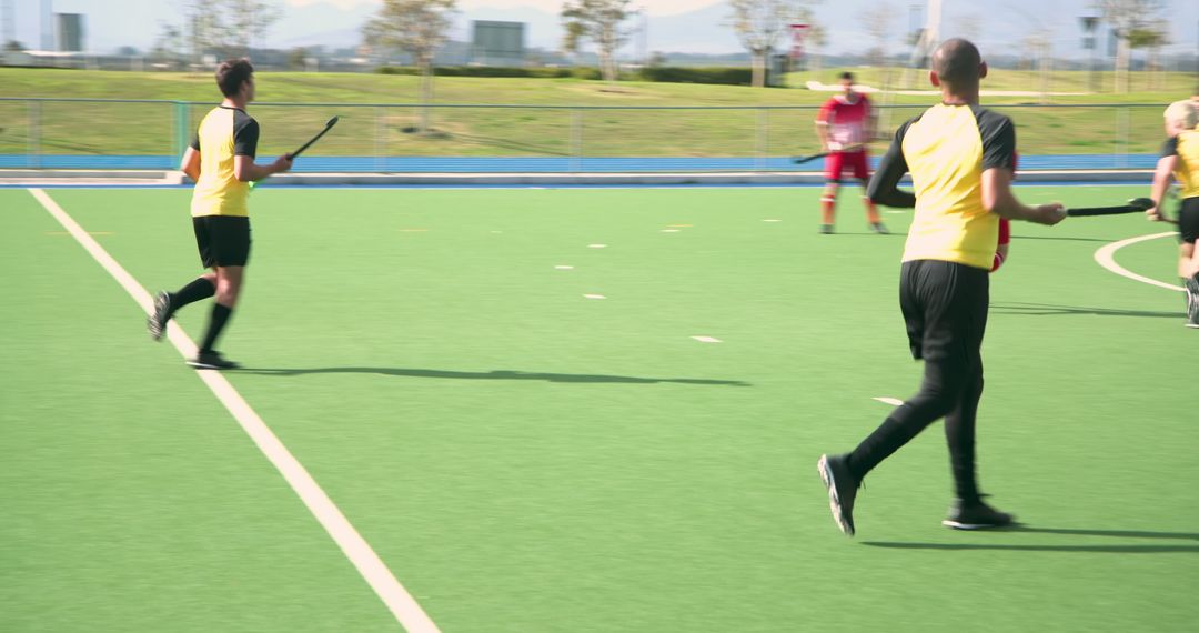Field Hockey Players in Match Action on Artificial Turf