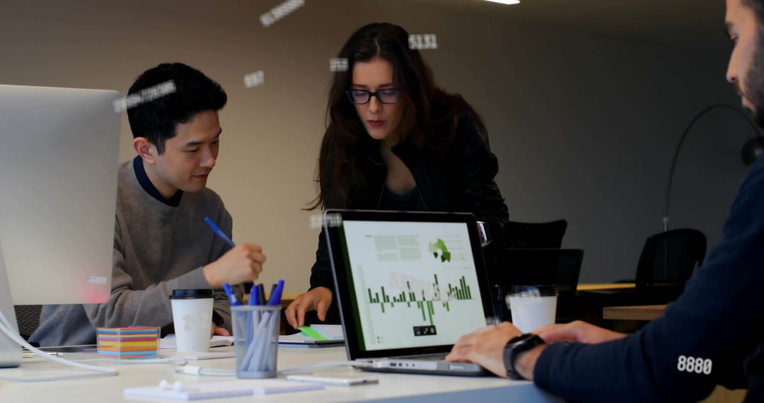 Diverse Team Collaborating on Digital Project in Modern Office