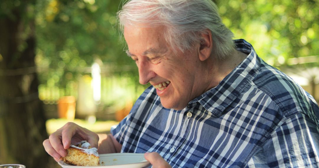 Senior Man Enjoying a Slice of Cake Outdoors - Free Images, Stock Photos and Pictures on Pikwizard.com