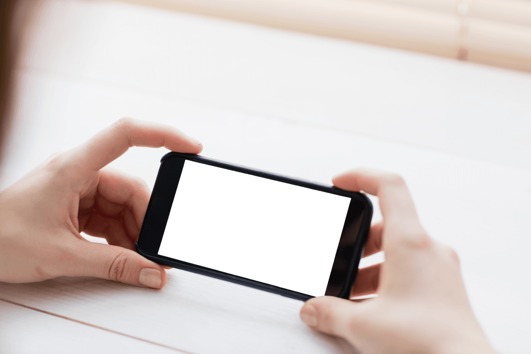 Woman Holding Smartphone Horizontally with Blank Screen
