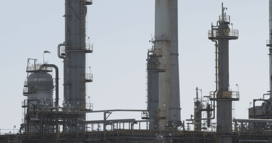 Vertical industrial towers on blue sky background