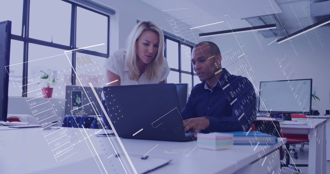 Diverse Colleagues Collaborating on Financial Data with Digital Overlay