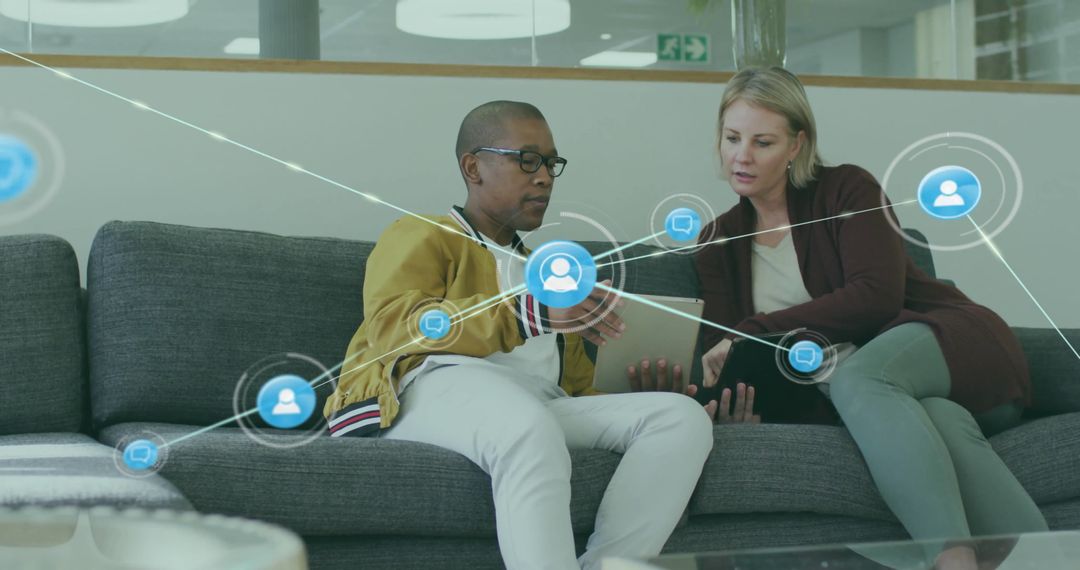 Colleagues Collaborating on Digital Network at Office