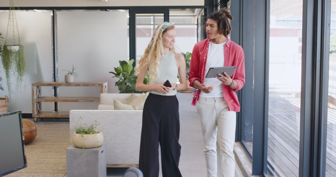 Two Colleagues Collaborating Enthusiastically in Modern Office
