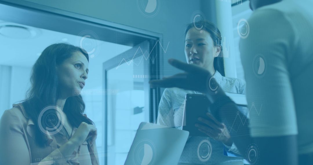 Diverse Professionals Discussing Data Analytics in Modern Office