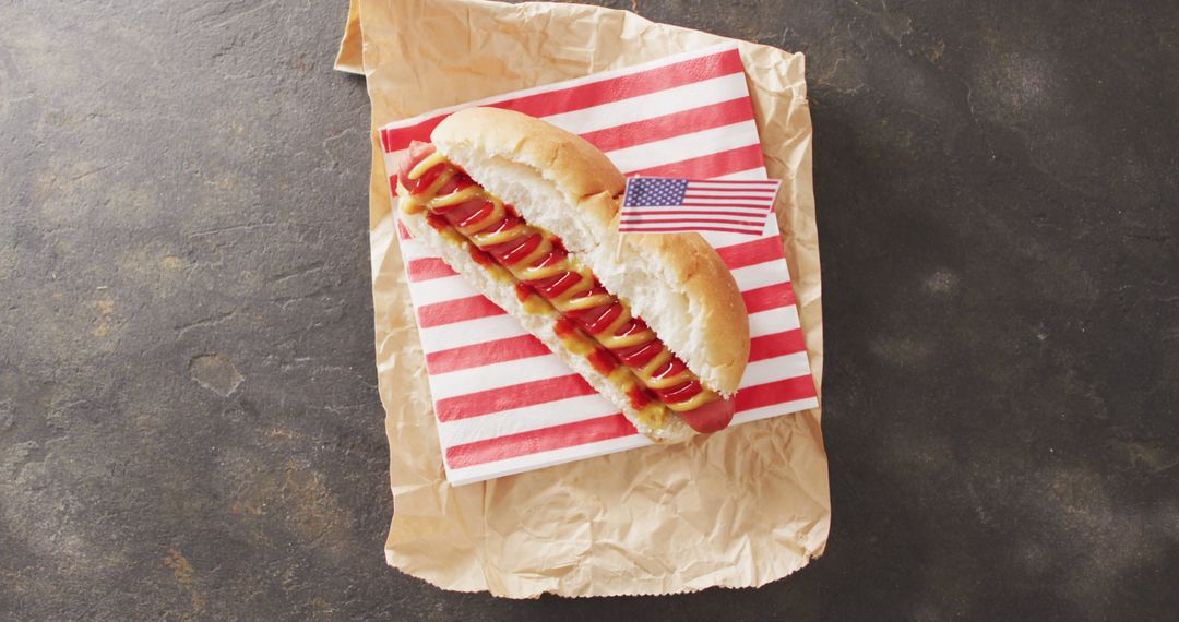 Image of hot dog with mustard and ketchup with flag of usa on a black surface - Free Images, Stock Photos and Pictures on Pikwizard.com