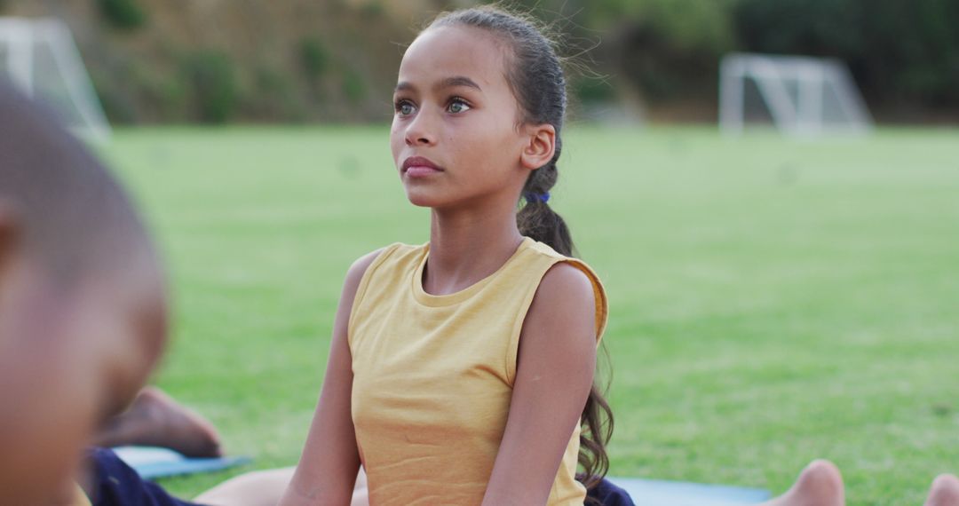 Young Girl Meditating During Outdoor Yoga Class - Free Images, Stock Photos and Pictures on Pikwizard.com